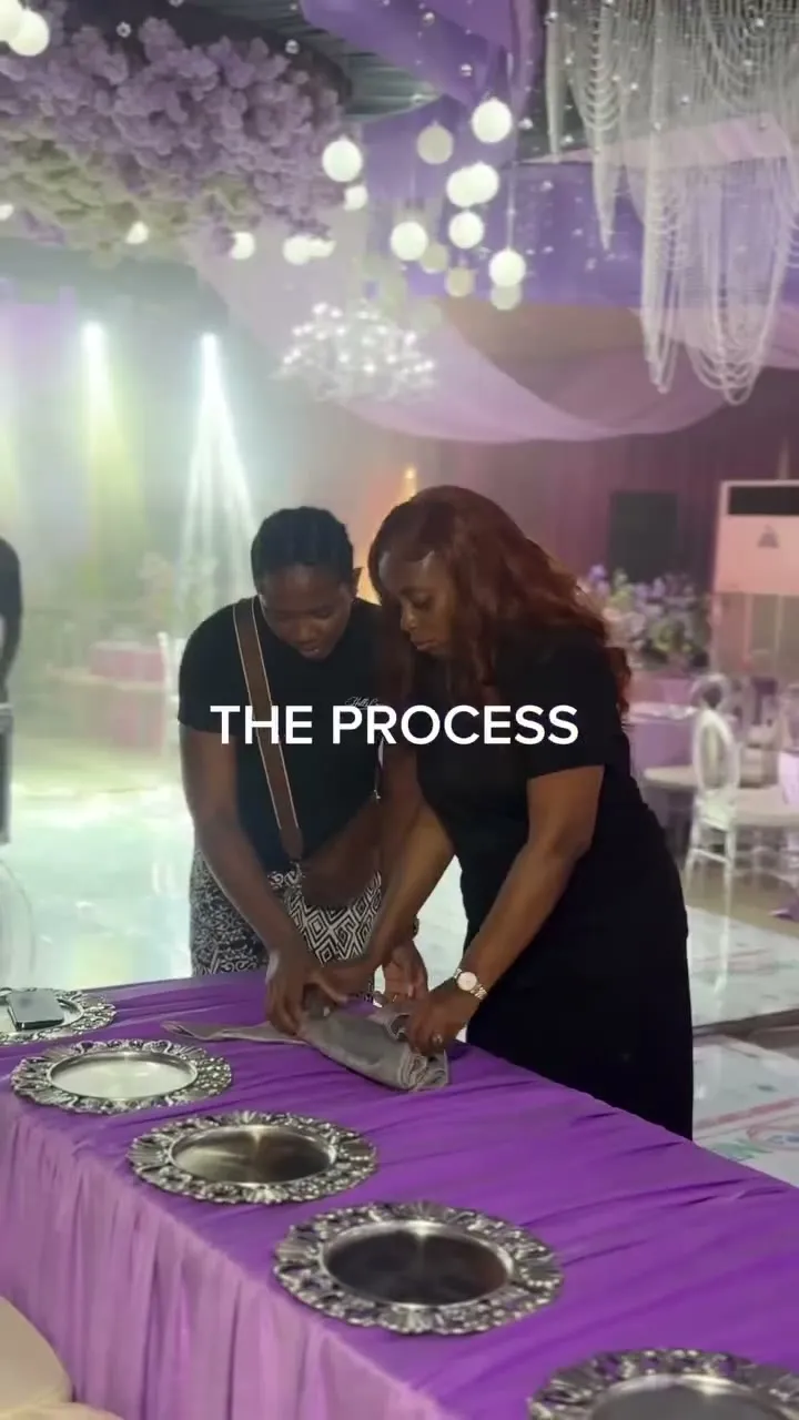 The planning team arranging place settings at the table
