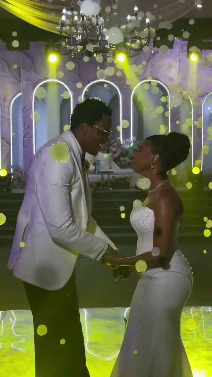 Esther and Tobi dancing in a white and lilac hall