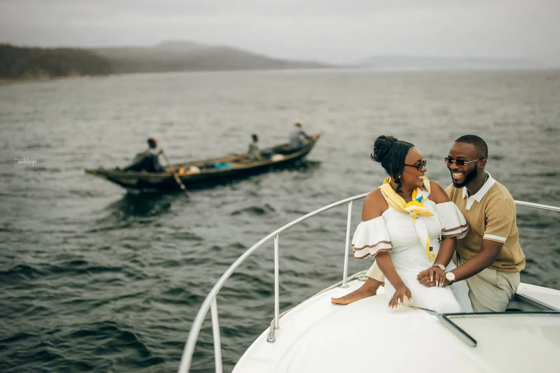 Hilda and Abraham on the bow of a boat in Lagos