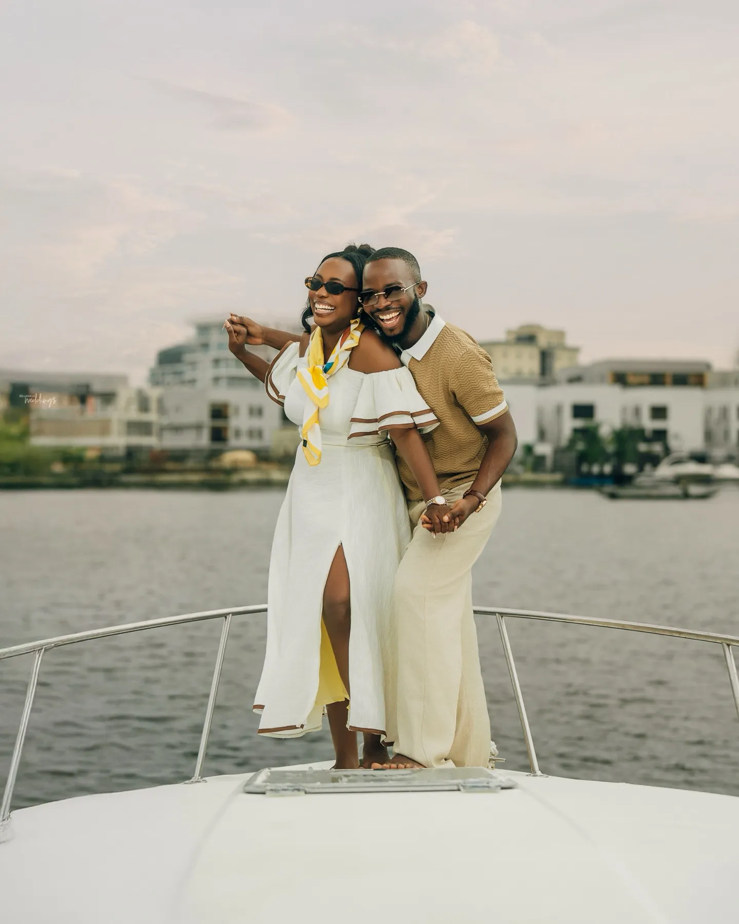 The couple on the yacht with the Lagos skyline behind