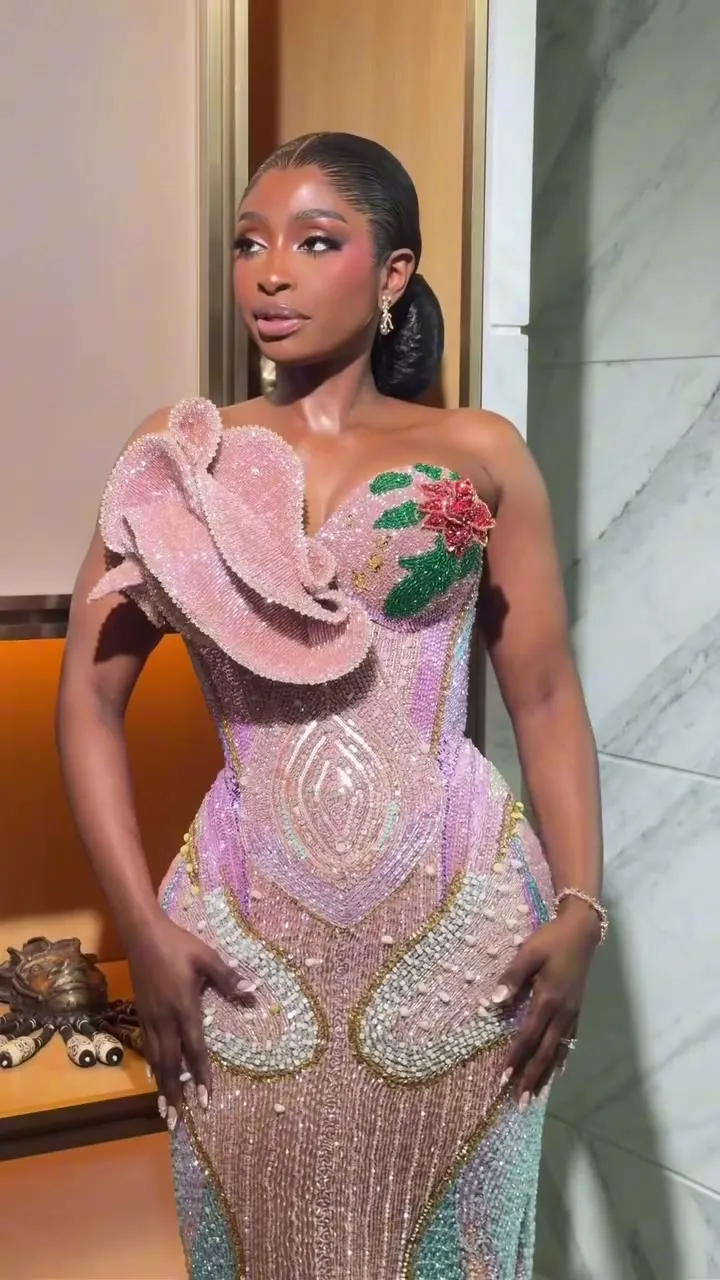 Kossy in a pink sculpted reception gown