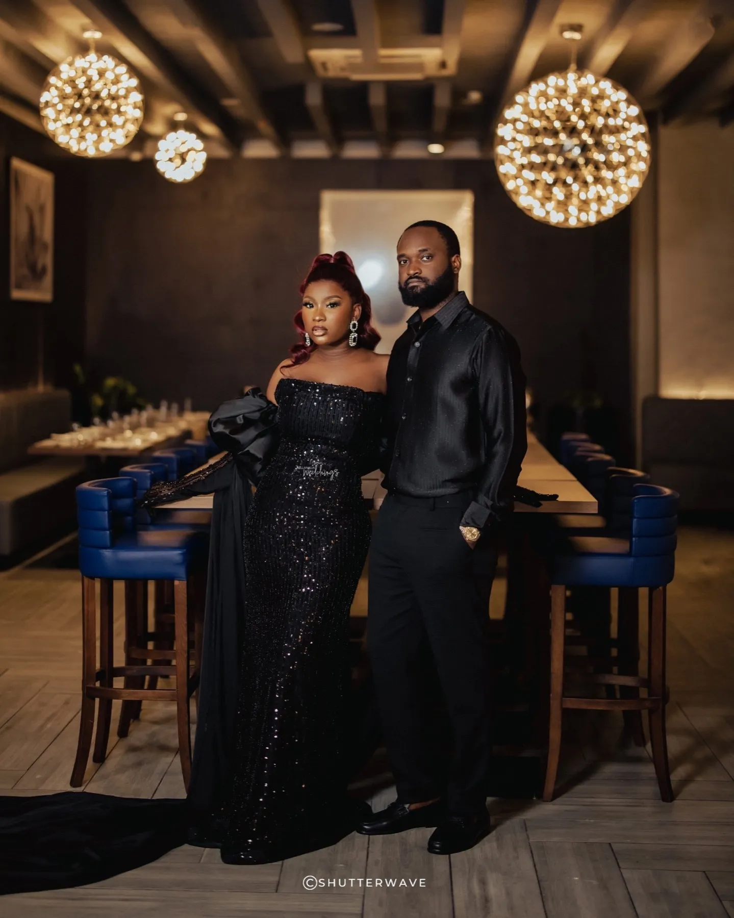 The couple at a bar counter in black